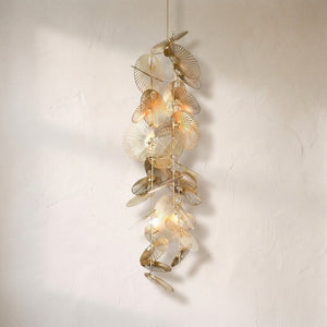 Cattail leaf spiral chandelier, brass fan-ribbed leaf discs spiralling down a slim stem