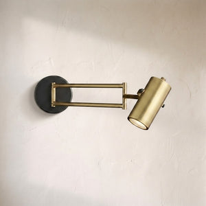 Cenora swing-arm wall sconce, articulated brass arm with an adjustable cylinder shade