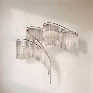 Crystal Spin chandelier, ribbon of clear glass rods twisting around a brass spiral rail