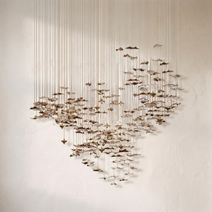 Galaxy Leaf Twisted chandelier, bronze and ivory sculptural leaves layered on slim brass rods