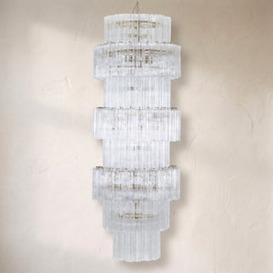 Manhattan chandelier, five stacked tiers of clear ribbed glass tubes on a tall column