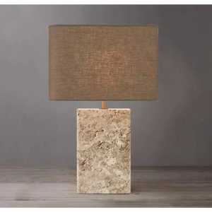 Travertine and copper table lamp in a living room