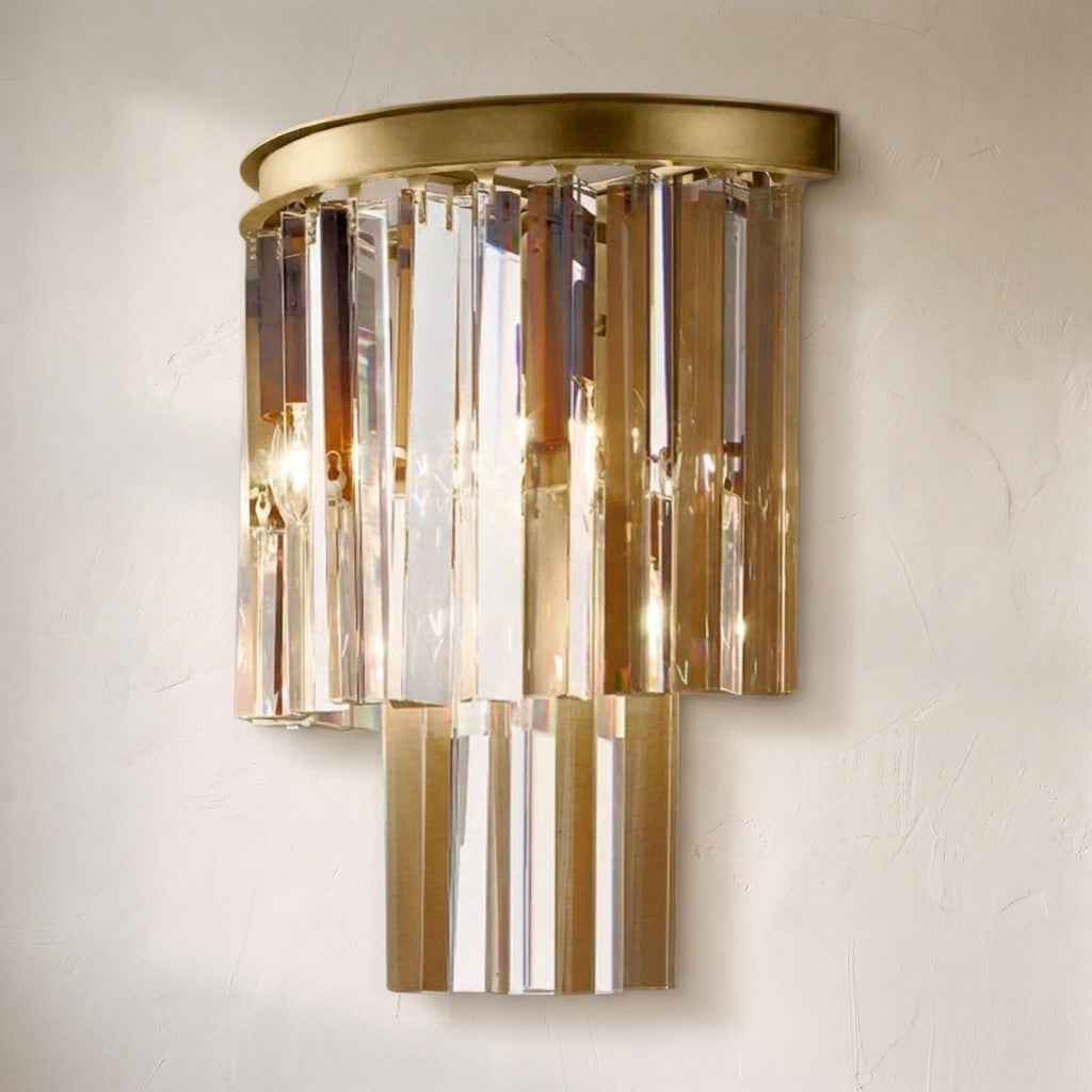 1920s Orion Art Deco wall sconce, three tiers of amber and clear crystal prisms under a round brass cap