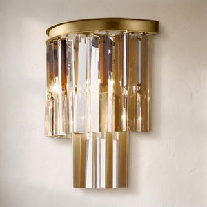 1920s Orion Art Deco wall sconce, three tiers of amber and clear crystal prisms under a round brass cap