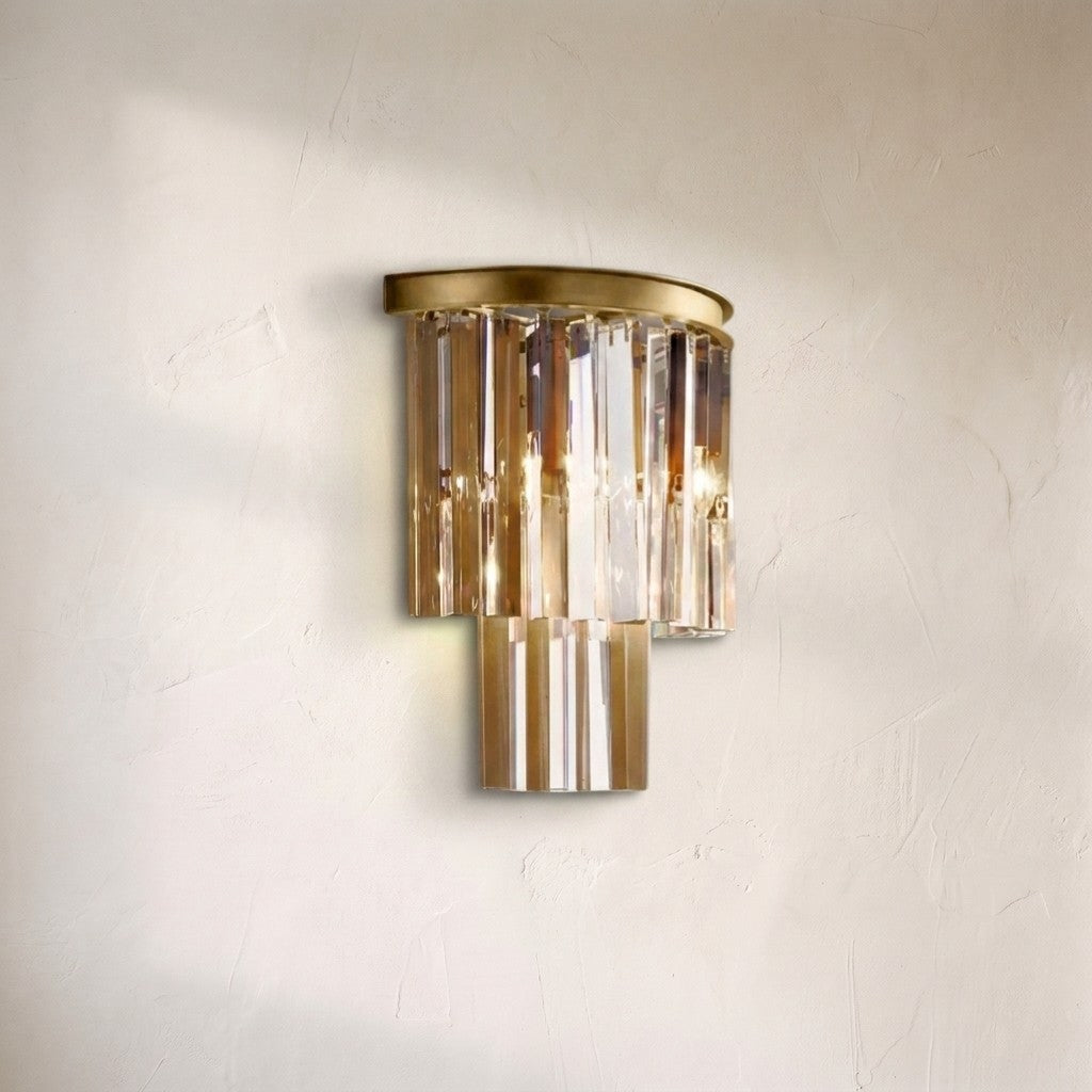 1920s Orion wall sconce, two tiers of amber and clear crystal prisms under a brushed brass cap