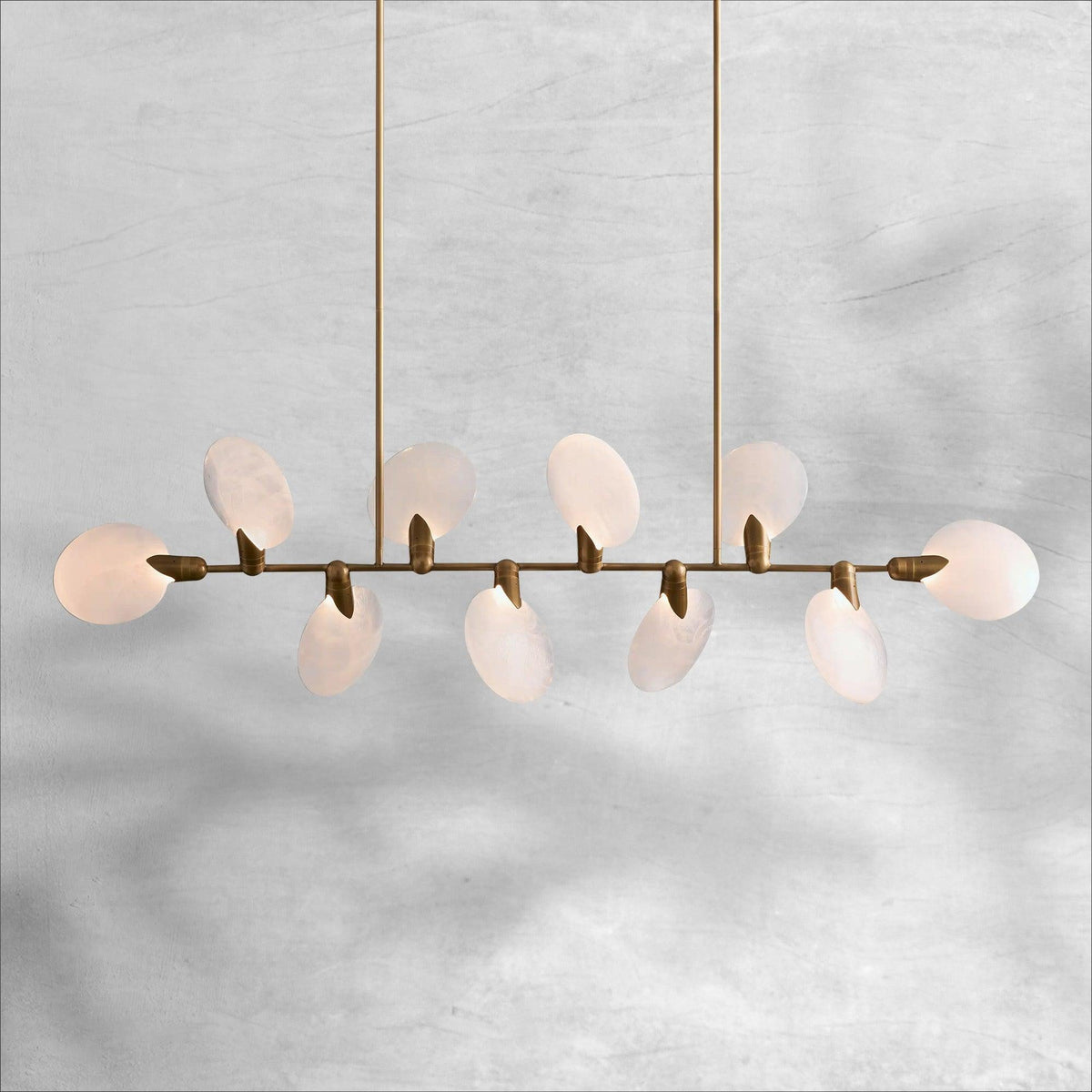 Lyla 62 inch linear chandelier full view with staggered alabaster petals