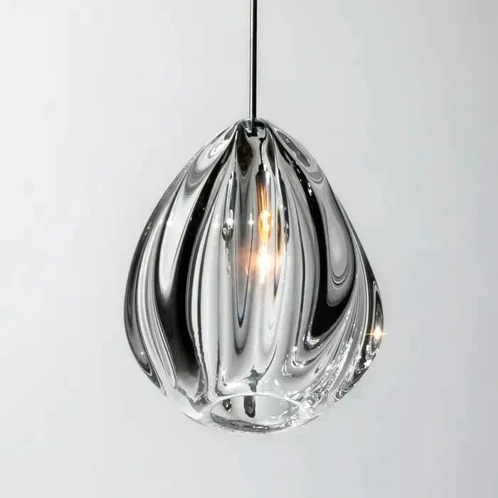Close-up of a single hand-blown glass teardrop pendant with ribbed texture