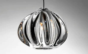 Detail of hand-blown glass shade showing organic ribbed swirls