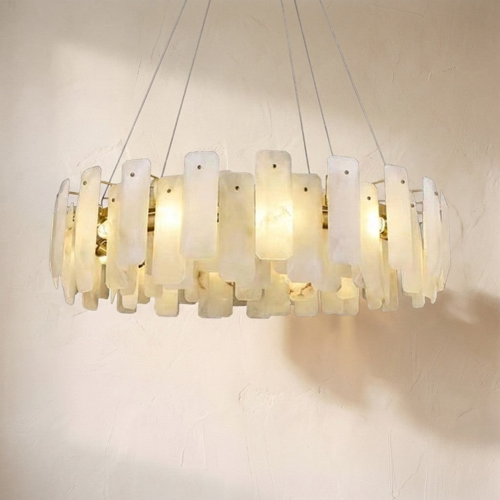 August alabaster round chandelier, overlapping backlit alabaster flakes on a brass drum frame
