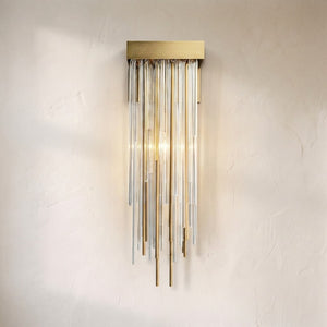 Caelix glass wall sconce, curtain of clear glass rods and brass tubes falling from a brass canopy