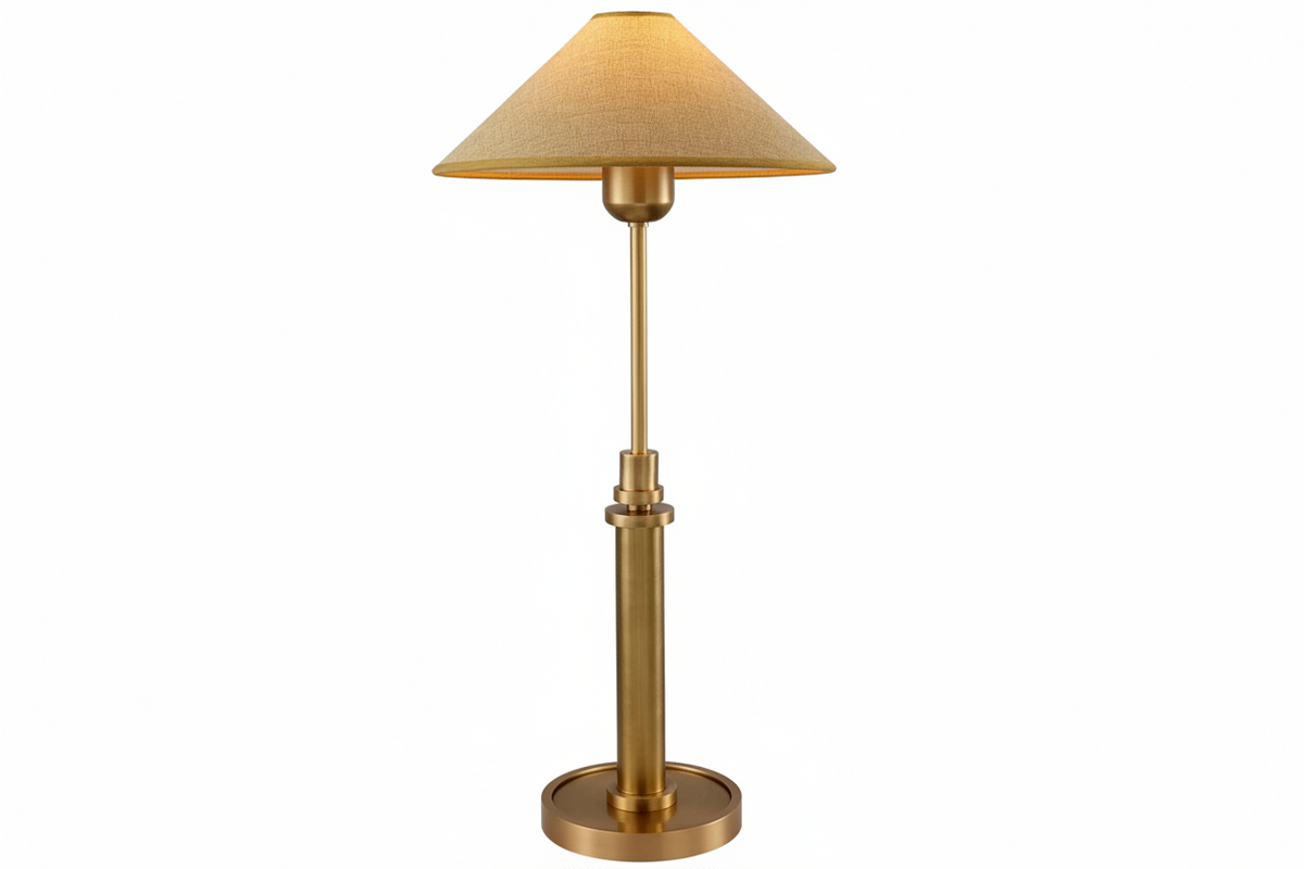 Polished copper base with fabric shade glowing warm