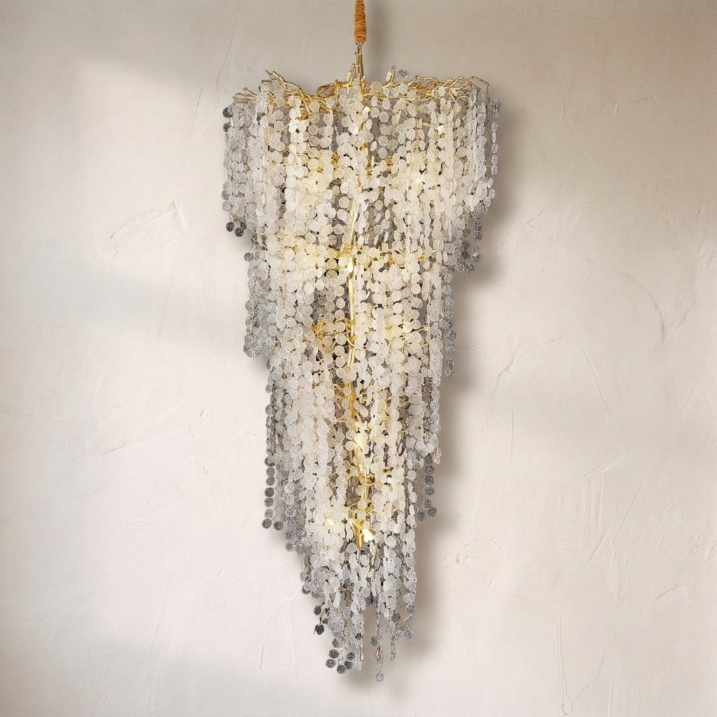 Ferja Quatre foyer chandelier, cascading strands of textured glass pennies on gilded branching arms