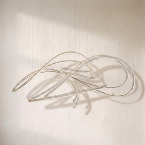 Inspiral chandelier, looping ribbons of clear glass rods coiling in a free-form knot