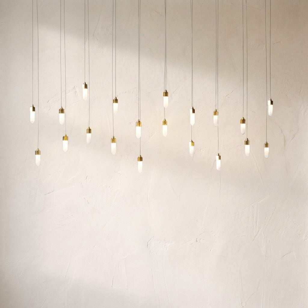 Leo rectangular chandelier with longer drops, the twenty opal pendants staggered across a plaster wall