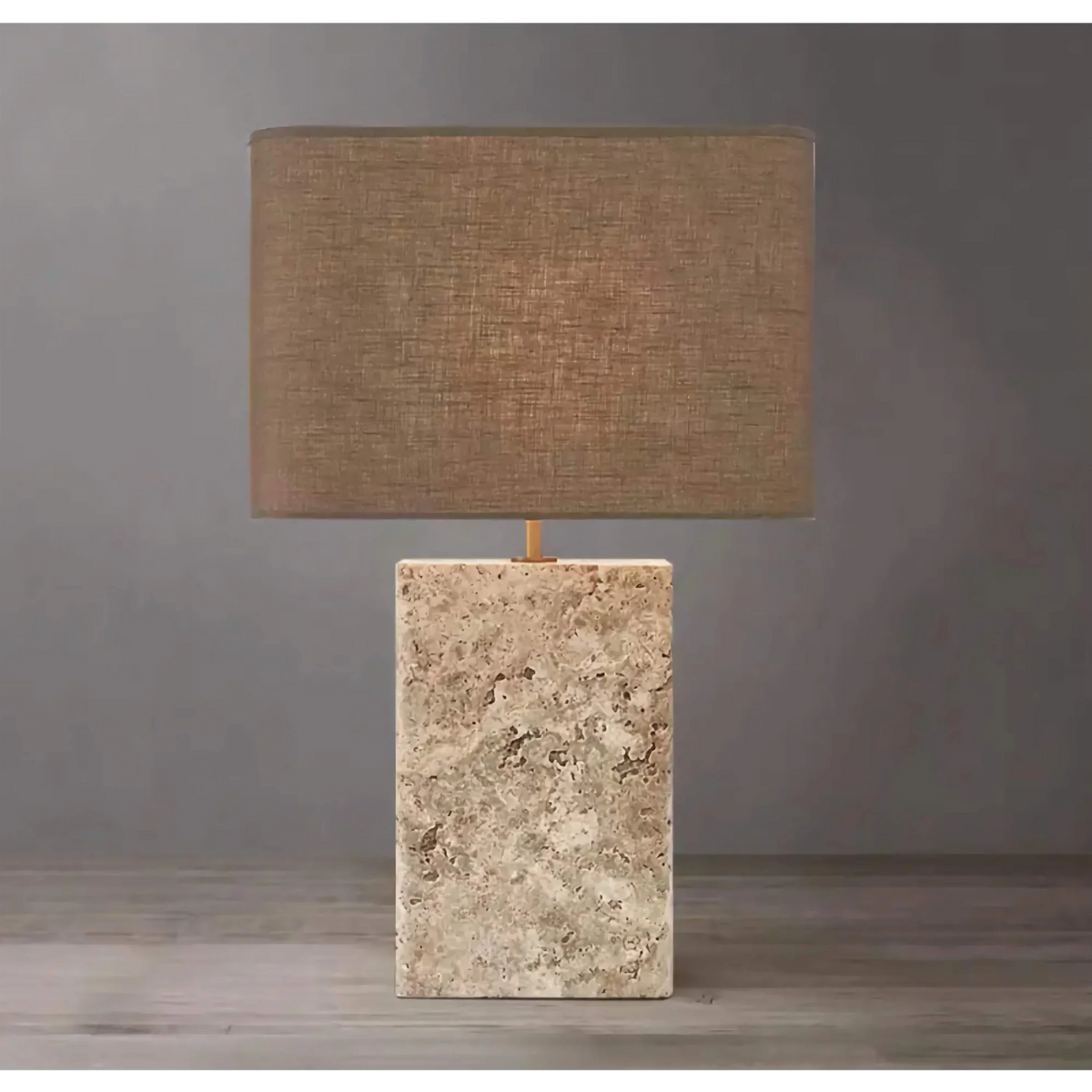 Travertine and copper table lamp in a living room
