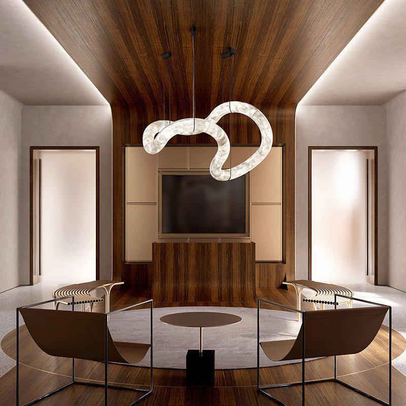 Sculptural ribbon alabaster LED pendant light in a wood panelled lounge