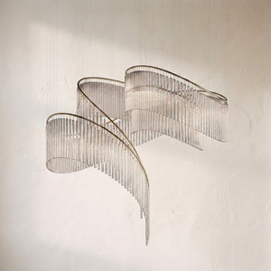 Rivella cascade fringe chandelier, curtain of clear glass rods sweeping around a brass rail