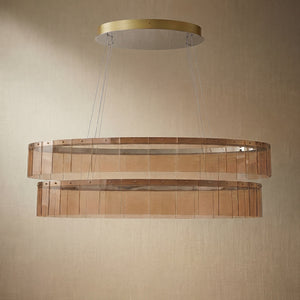 Yiosi Astor 59 inch oval handmade glass linear chandelier with antique brass finish — modern dining pendant